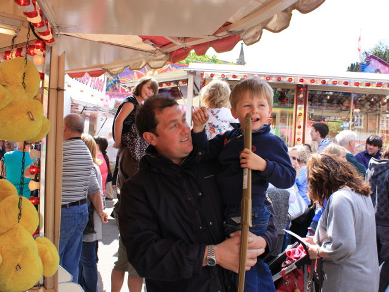 Father and child on ride at the Rothwell Fair